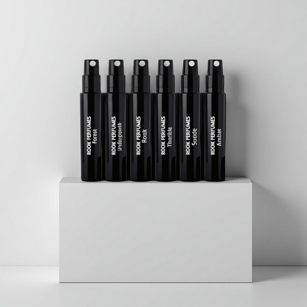 Rook Perfumes Discovery Set Sampler featuring various fragrance vials and a 15% voucher in a stylish display.
