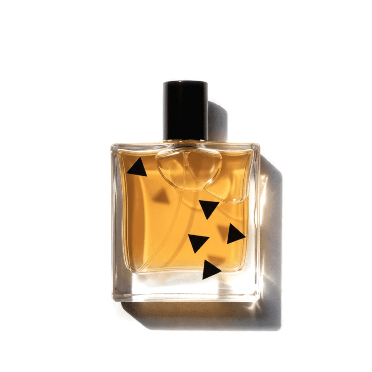 Rook Perfumes Suede Eau de Parfum bottle with bold leather and cognac notes, elegant glass bottle with silver cap.